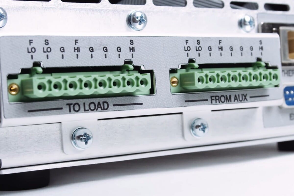 Close up view of a Vektrex source measure unit force sense switch, located behind the unit.
