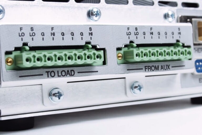 Close up view of a Vektrex source measure unit force sense switch, located behind the unit.